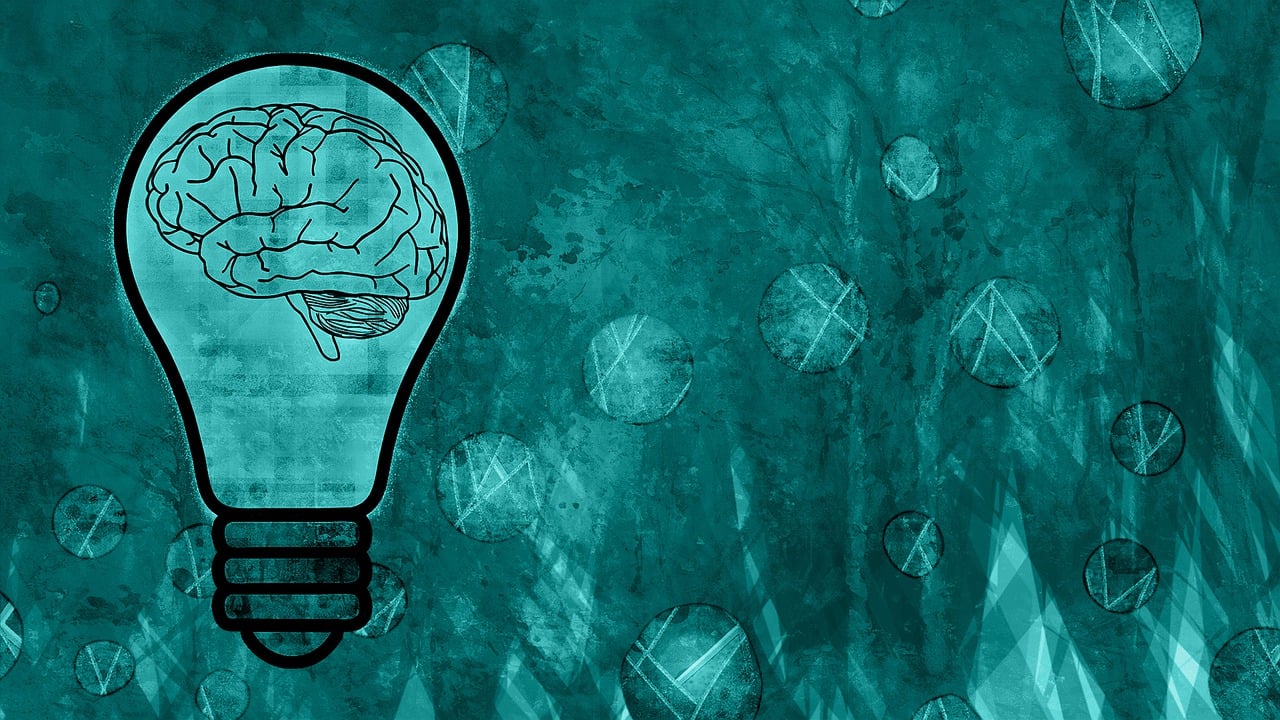 Illustration of a brain inside a glowing light bulb representing innovation and new ideas in clinical research